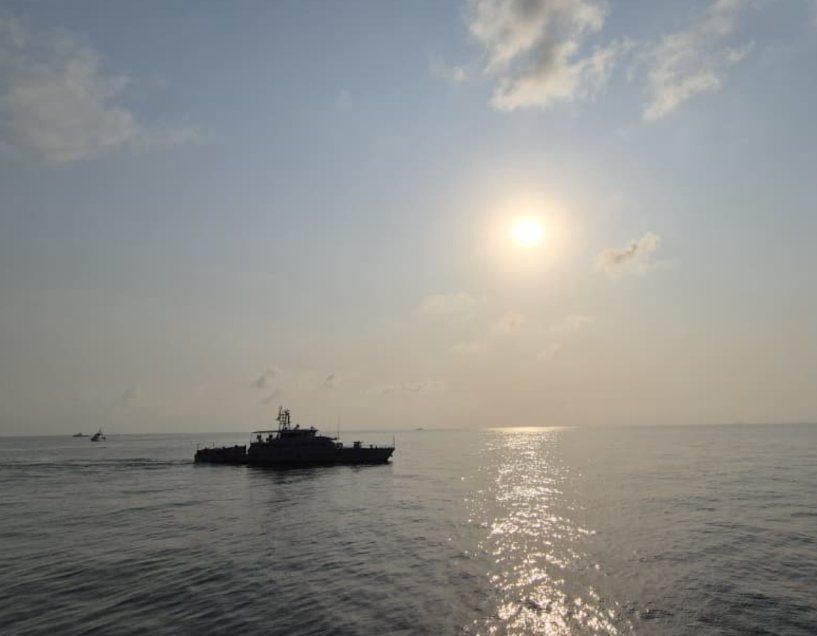 Patrol and support vessel at sea at sunset
