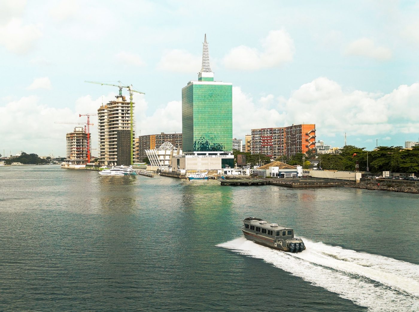 Passenger boat on Lagos Lagoon by Civic Centre Towers, Victoria Island